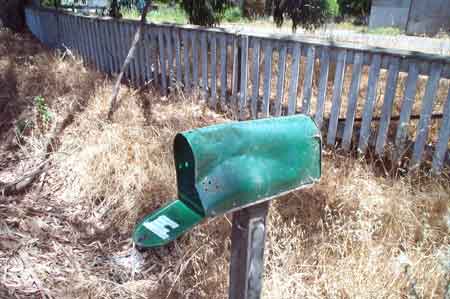 bashed-in mailbox