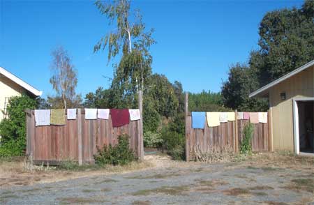 wet towels hanging on the fence